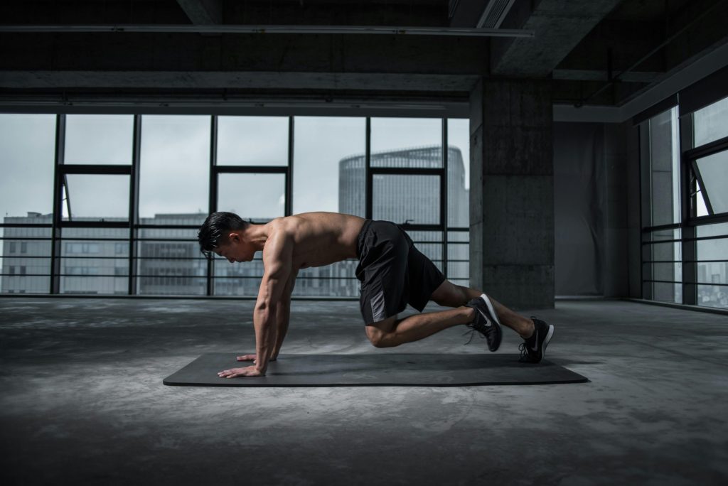 Man stretching outdoors – health tips for life after 40