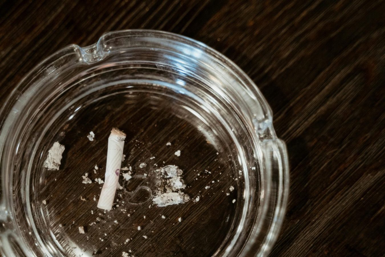 Broken cigarette in ashtray representing health gains after the easy way to quit smoking