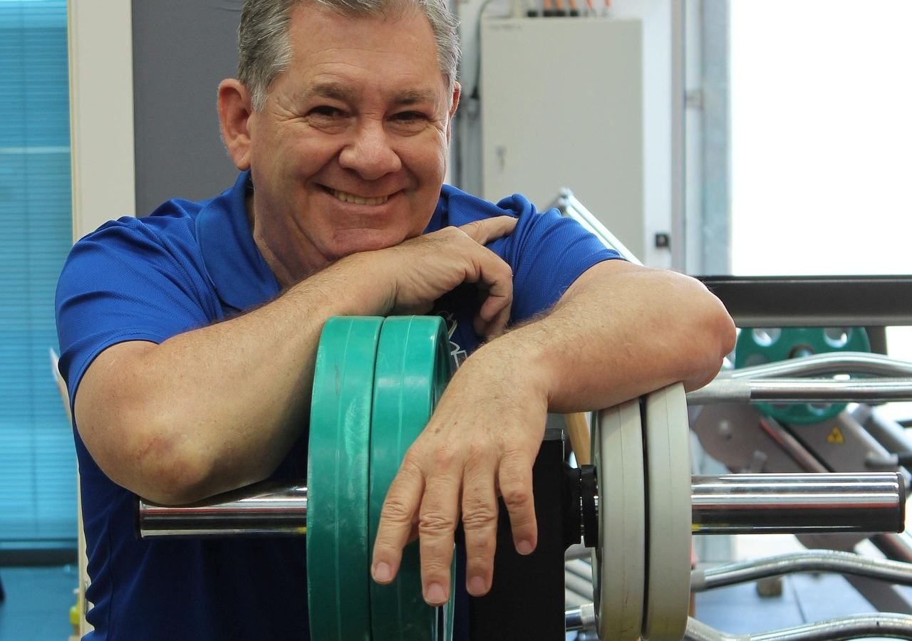 man over 40 strength training in gym